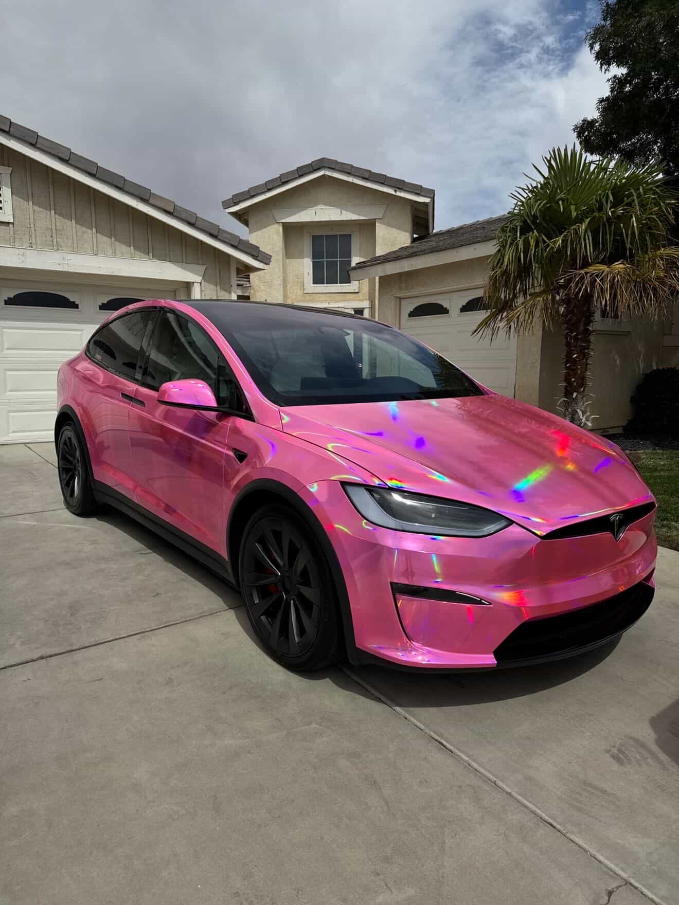 Pink chrome holographic wrapped Tesla Model X by Exclusive Autostyling
